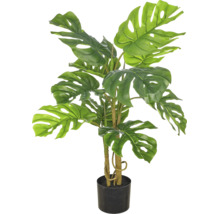 Kunstplant Monstera in zwarte pot met kenmerkende geperforeerde bladeren.