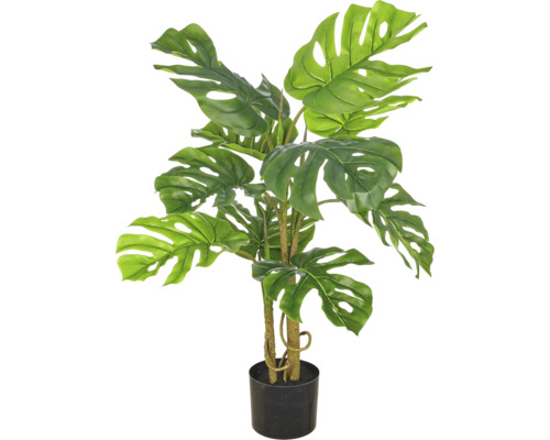 Kunstplant Monstera in zwarte pot met kenmerkende geperforeerde bladeren.