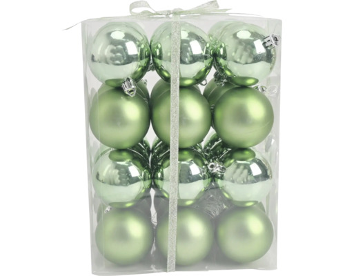 12 groene kerstballen in matte en glanzende uitvoering, verpakt in een transparante doos met lint.