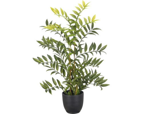 Kunstplant in zwarte pot met talrijke lancetvormige bladeren.