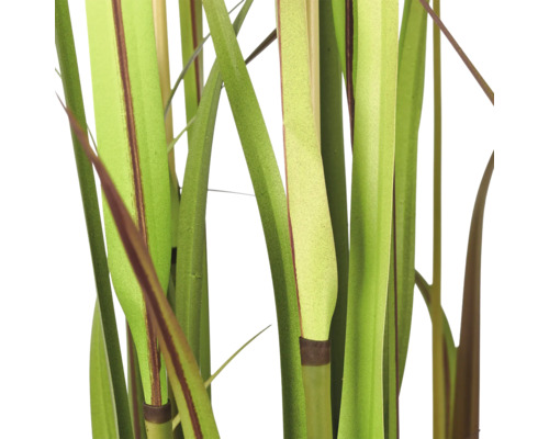 Detailopname van de sprieten van een kunstmatig siergras voor de binnendecoratie.