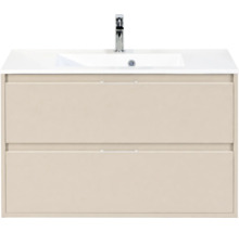 Beige wastafelmeubel met twee laden, witte wastafel en verchroomde kraan.
