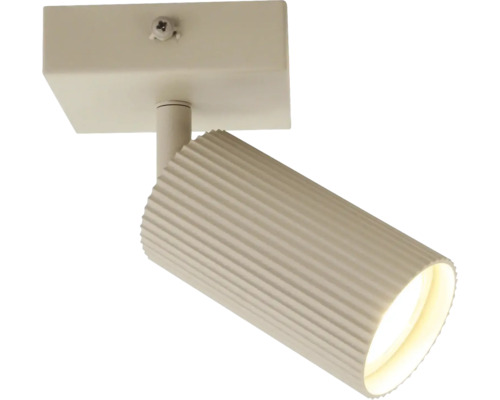 Een enkele plafondspot met een geribbelde cilindrische lampkop voor directe verlichting