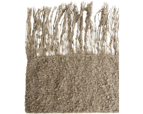 Getextureerde woondeken met franjes als decoratief huishoudtextiel voor een gezellige sfeer.