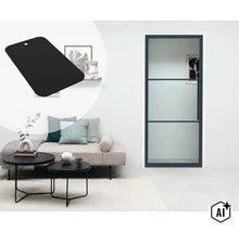 Moderne glazen deur met zwart frame en roeden in een stijlvol ingerichte woonkamer met bank en bijzettafels. (Image AI modified or generated)