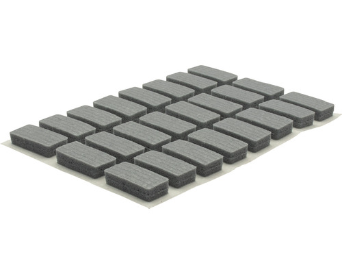 Grijze meubelviltglijders op een vel