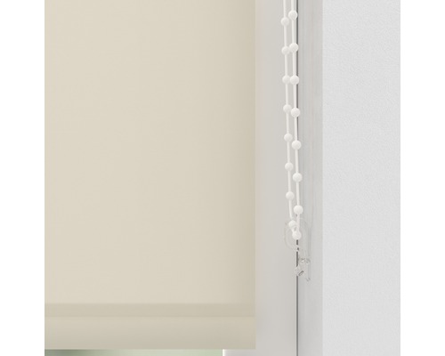 Beige jaloezie met bedieningsketting in het venster