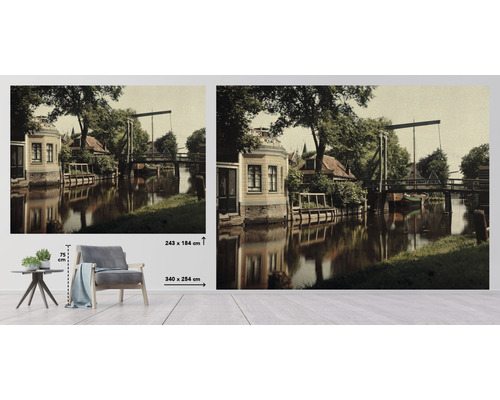 Fotobehang met een motief van een stad aan de rivier met een brug