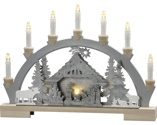 Kerstkandelaar met kerststal en zeven kaarsen