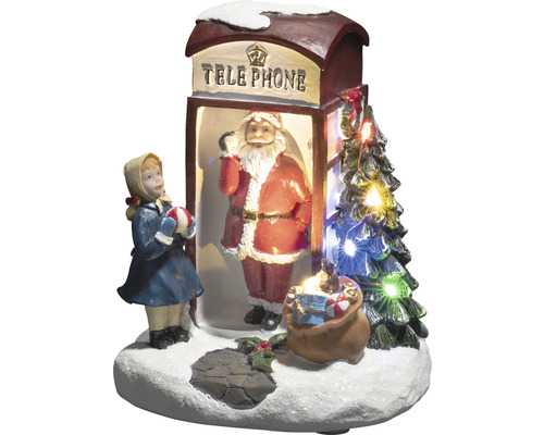 Decoratieve kerstscène met kerstman in telefooncel, meisje en kerstboom met verlichting