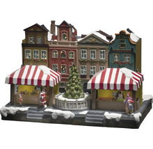 Kerstmarktscène met verlichte huizen en figuren