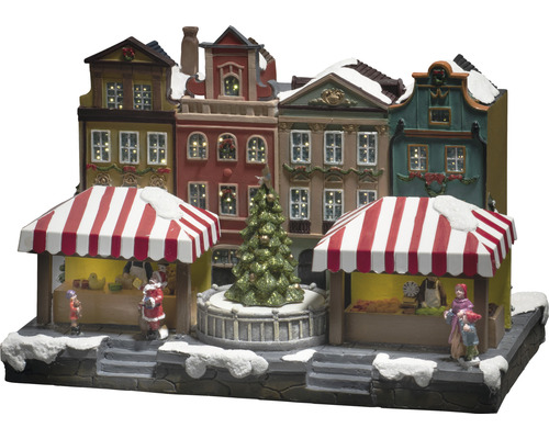 Kerstmarktscène met verlichte huizen en figuren