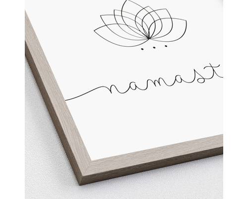 Ingelijste afbeelding met lotusbloem en het woord Namaste