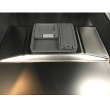 Interieur van een vaatwasser met een doseerbak voor afwasmiddel