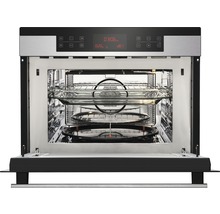 Geopende magnetron met draaiplateau en grillrooster