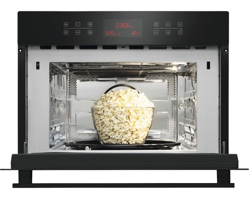 Magnetron met een kom popcorn