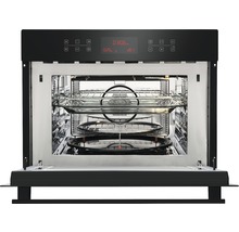 Geopende magnetron met draaiplateau en grill