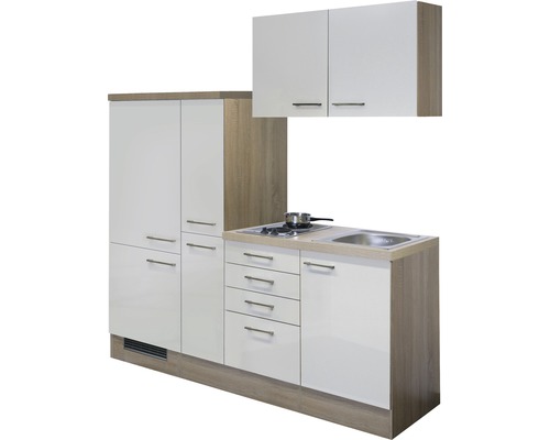 Compacte keuken met wasbak, kookplaat, kasten en lades