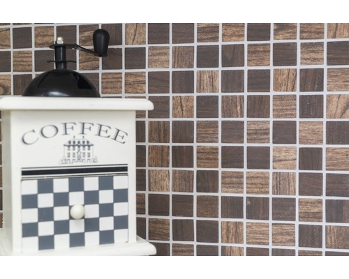 Decoratieve koffiemolen voor mozaïekachtergrond