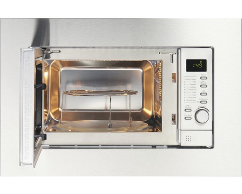 Geopende roestvrijstalen magnetron met draaiplateau en grillrooster