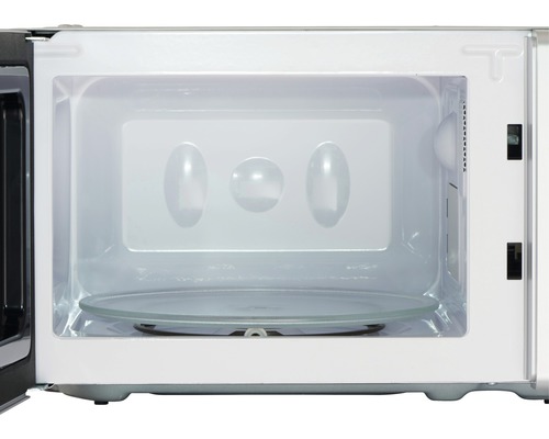 Interieur van een magnetron met draaiplateau