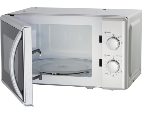 Geopende magnetron met draaiplateau en bedieningselementen