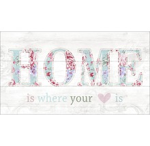 Decoratieve wanddecoratie met bloemmotief en de tekst thuis is waar je hart is.