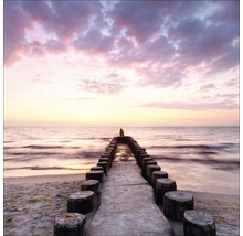 Steiger aan zee bij zonsondergang