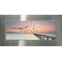 Magneetfoto met een motief van een meer, een steiger en een zwerm vogels