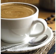 Koffiekop met schotel en lepel