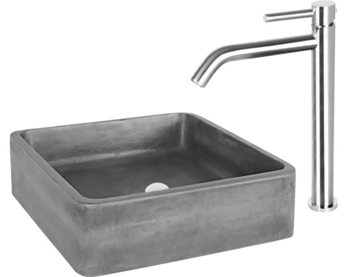 Vierkante wastafel van beton met kraan