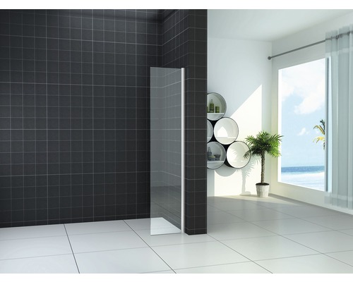 Lichte badkamer met glazen douchewand, donkere tegels en ronde schappen