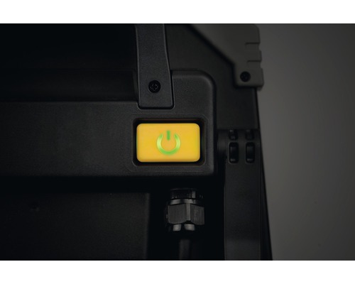 Gele aan/uit-knop op zwart apparaat