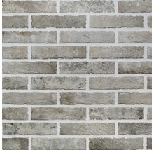 Close-up van een wandtegel in baksteenmotief