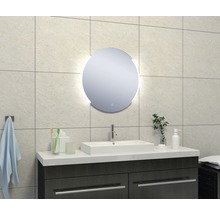 Moderne badkamer met ronde spiegel, wastafel en onderkast.