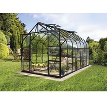 Glazen en metalen kas in de tuin