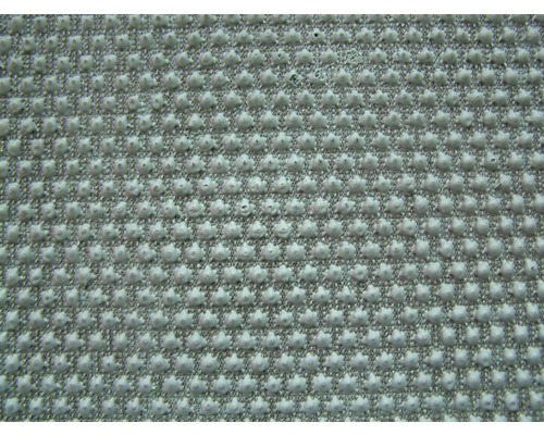 Close-up van een gestructureerd oppervlak met noppen