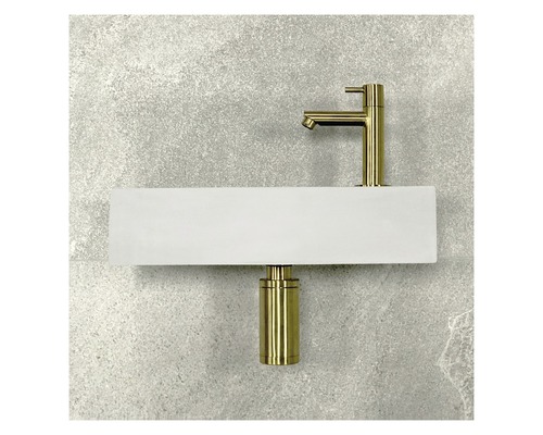 Op een wastafel gemonteerde kraan en sifon voor een wand