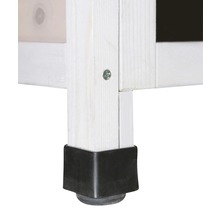 Detailopname van een meubelstuk met een houten poot en een zwarte hoekbeschermer