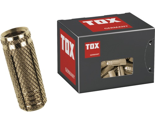 Messing spreidplug naast een verpakking