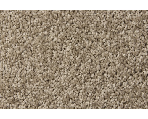 Close-up van een beige tapijt.