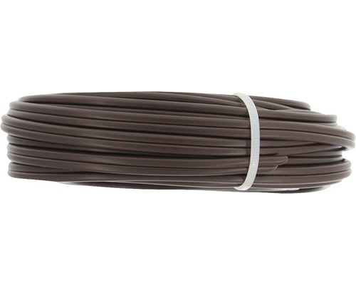 Bruine irrigatiebuis opgerold