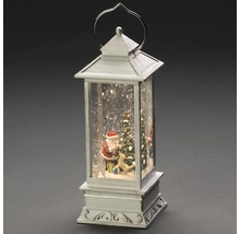 Decoratieve lantaarn met kerstman, boom en kunstsneeuw voor een kerstsfeer