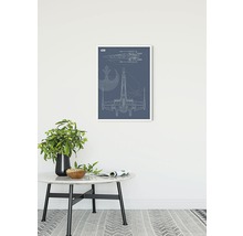 Ingelijste muurkunst met Star Wars X-Wing blauwdruk op een tafel