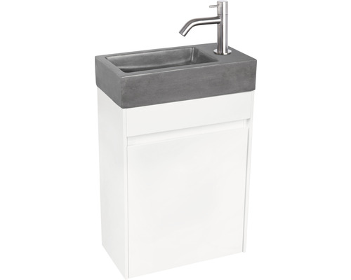 Wastafelcombinatie met betonnen wastafel en kraan voor witte onderkast