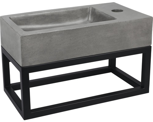 Wastafel van beton met zwart metalen frame