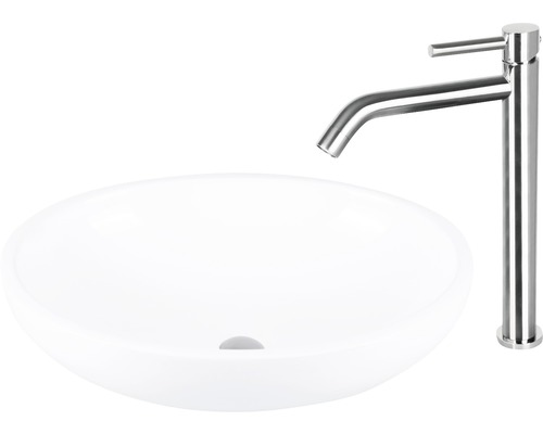 Wastafel van keramiek met kraan van roestvrij staal