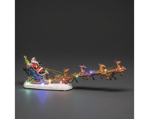 Kerstdecoratiefiguur met kerstman in slee en rendieren met verlichting