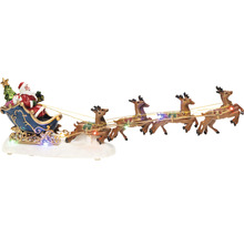Decoratieve kerstscène met de kerstman in een slee, getrokken door rendieren