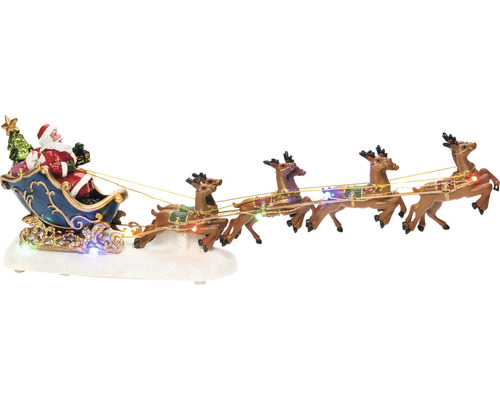 Decoratieve kerstscène met de kerstman in een slee, getrokken door rendieren